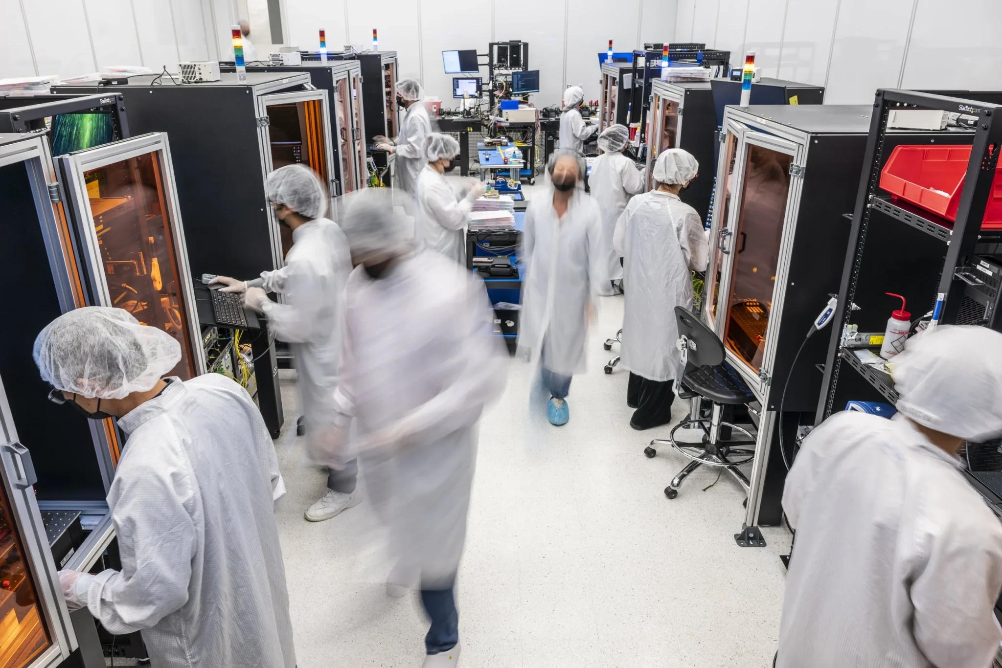 PsiQuantum personnel inside the fiber attach assembly facility at PsiFactory in Milpitas, California. PsiQuantum’s