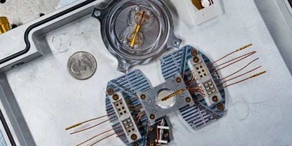 A trapped ion simulator on a metal tray